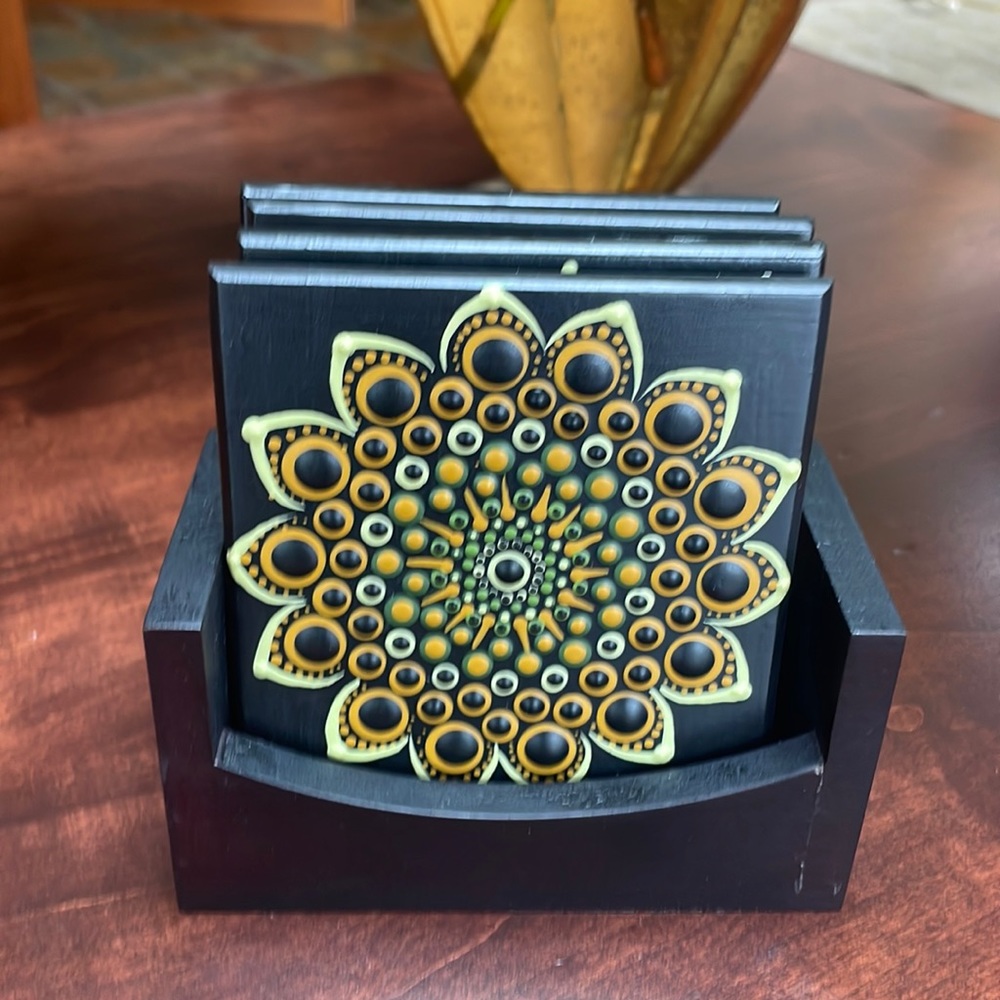 Custom coasters set a four with stand. Ups cycled.